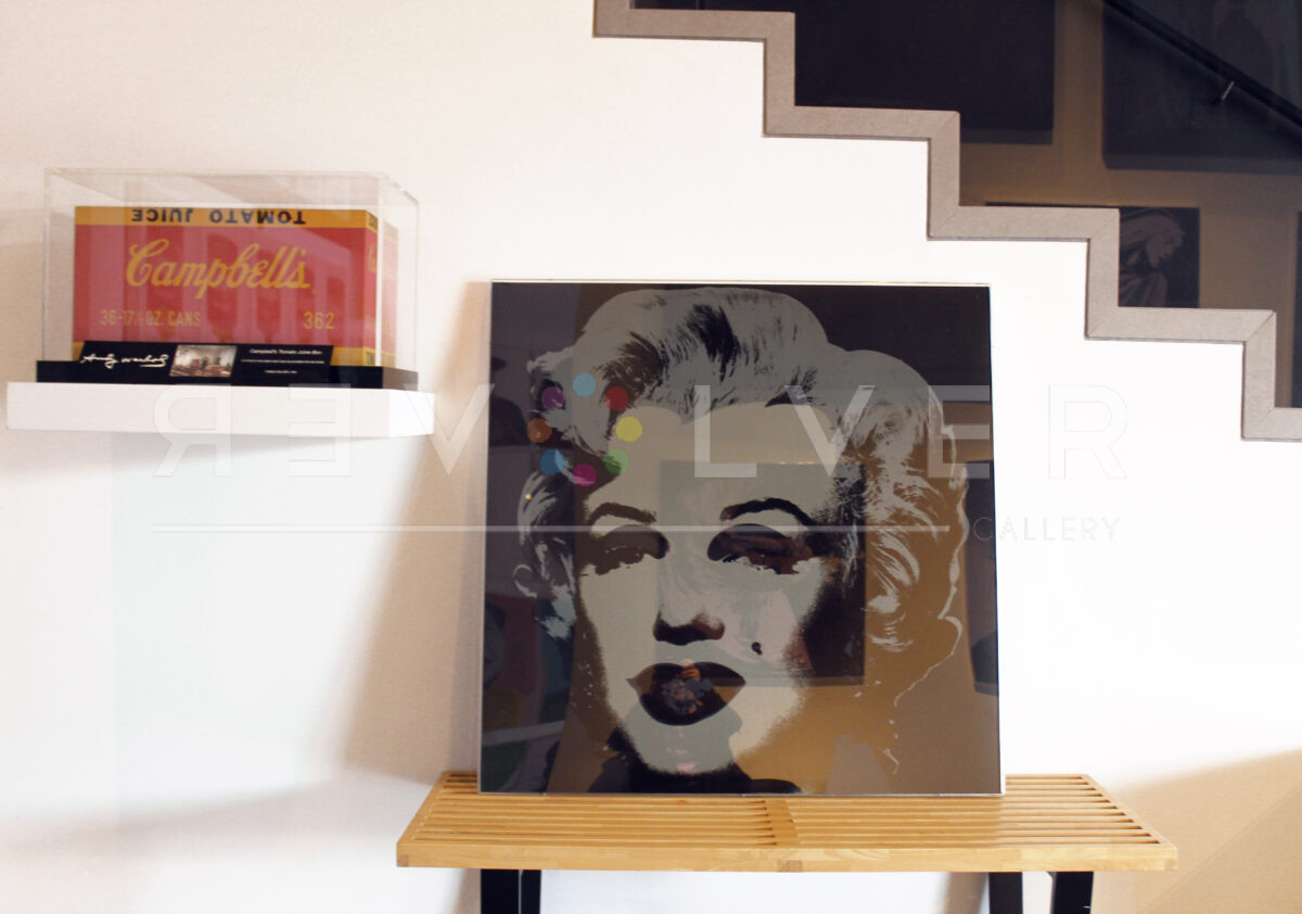 The Marilyn Monroe 24 screenprint in a plexibox frame inside Revolver Gallery.