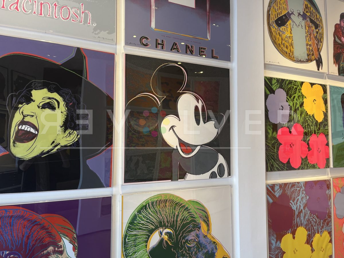 The wall at Revolver Gallery with Mickey Mouse and other Andy Warhol artworks