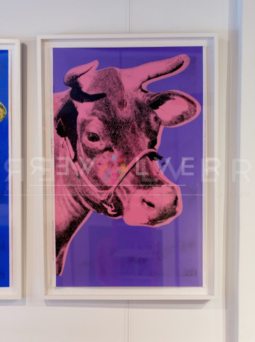 Cow12A by Andy Warhol in a frame