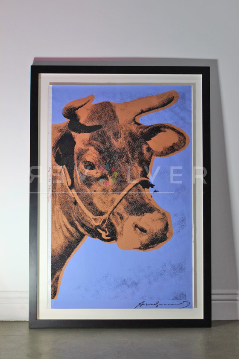 Cow FS II.11A by Andy Warhol in a frame