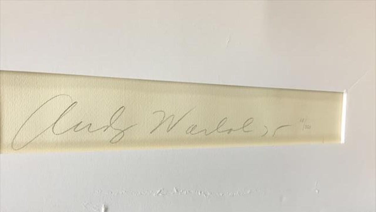 Shows Andy Warhol's signature on the back of the Ladies and Gentlemen print.