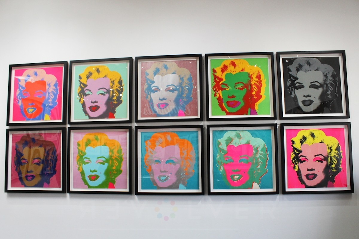Warhol's full marilyn suite hanging on the wall.