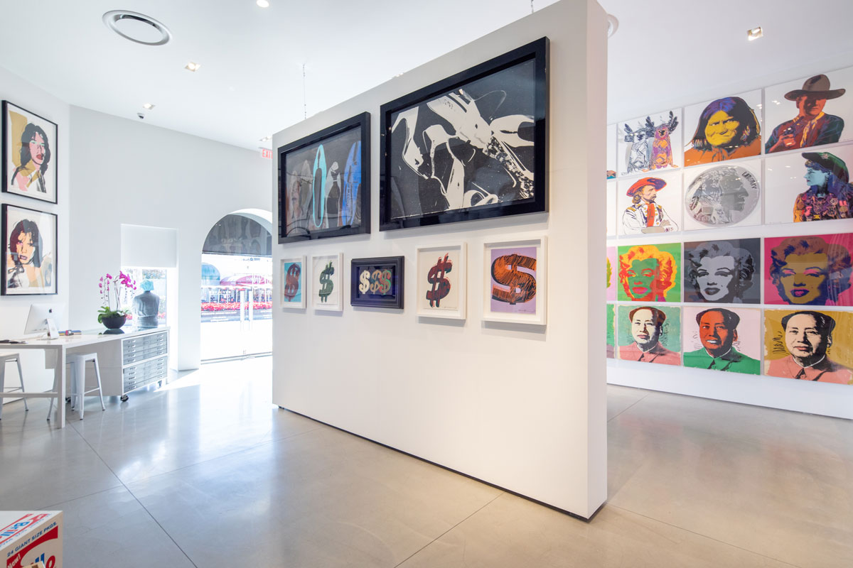 Inside Revolver Gallery on Sunset Blvd, Shoes, Mick Jagger, Dollar Signs on gallery wall.