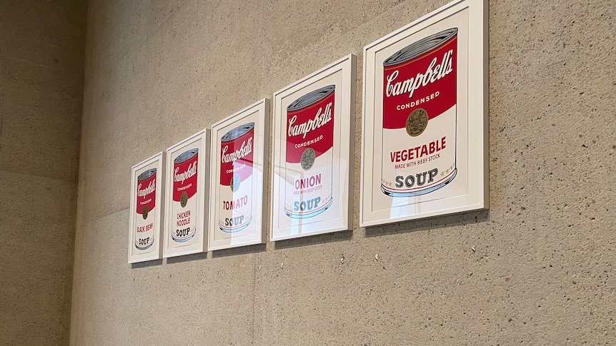 1/2 of Warhol's Campbell's Soup I portfolio hangs on the wall as the other prints were removed for cleaning.