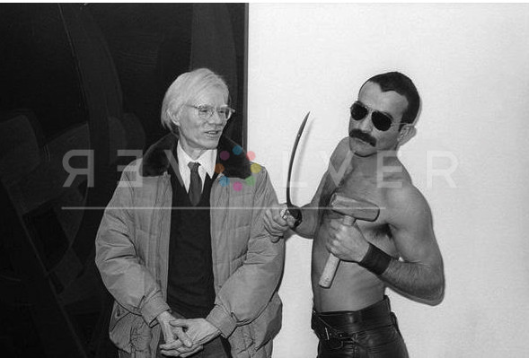 Andy Warhol and Victor Hugo holding a hammer and sickle, at Castelli Gallery, 1977. Photograph by Allan Tannenbaum.