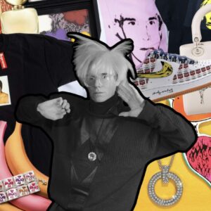 Andy Warhol stands in front of a digital collage composed of products from the Andy Warhol Foundation's commercial collaborations with brands and retailers.